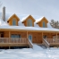 Log home in winter, snow