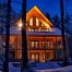 Log home at night, winter