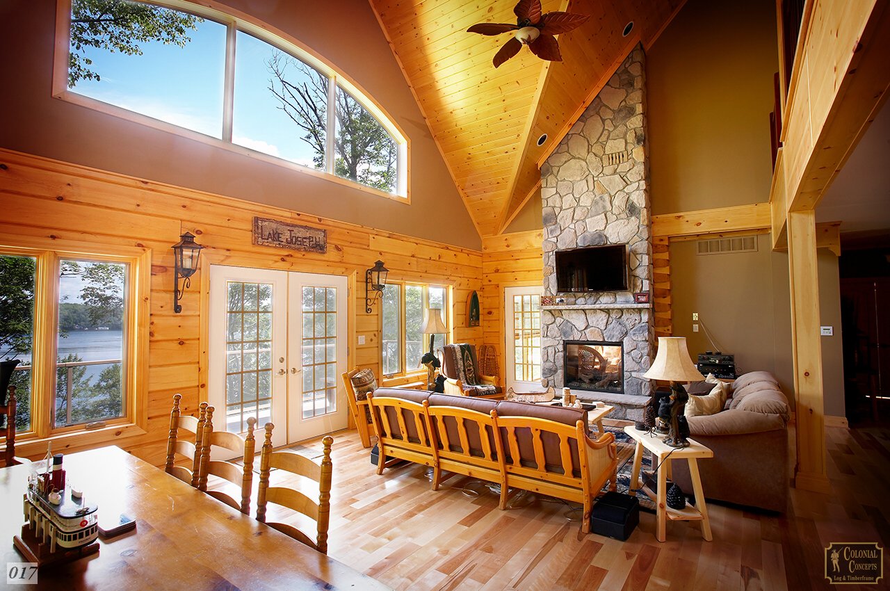 Log home living room with fireplace and lake, Muskoka Ontario