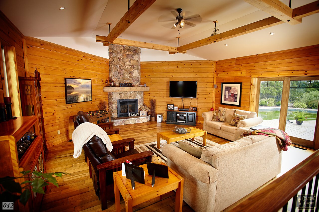 log home living room with stone fireplace, Ontario Canada